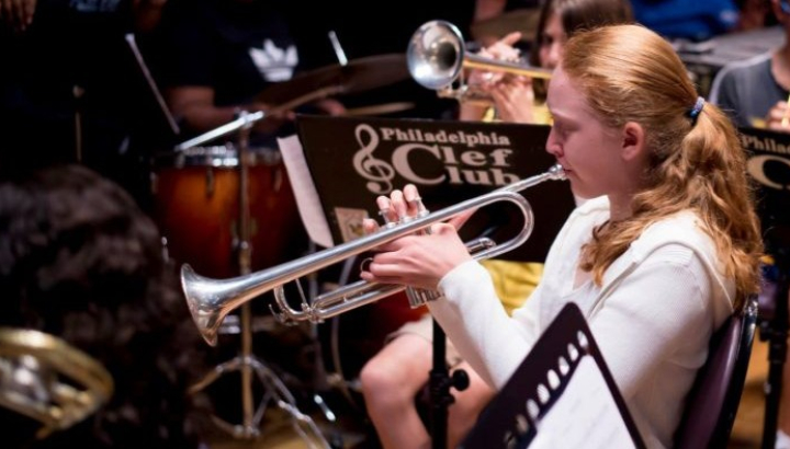 Woman musician playing trumpet